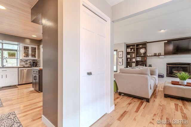 2376 Bob White Ct SE, Grand Rapids, MI 49546 - interior space featuring light wood-style flooring, recessed lighting, and a fireplace