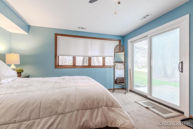 2376 Bob White Ct SE, Grand Rapids, MI 49546 - carpeted bedroom featuring access to exterior, multiple windows, and visible vents