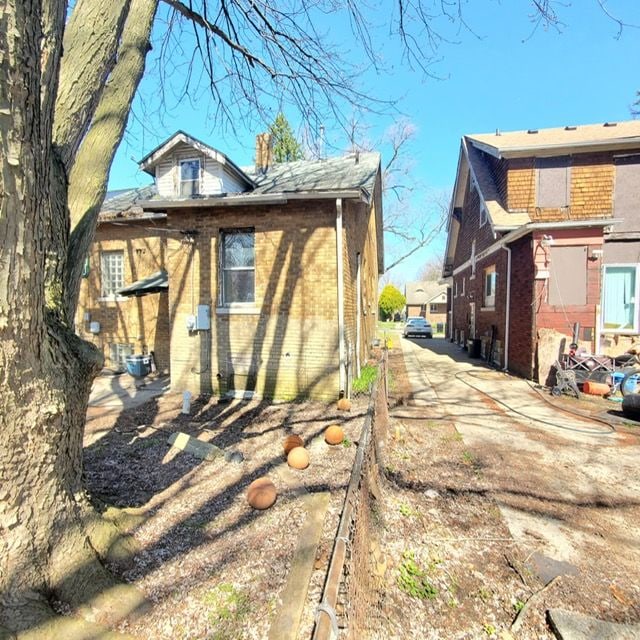 11060 Wilshire Dr, Detroit, MI 48213 - view of home's exterior featuring brick siding