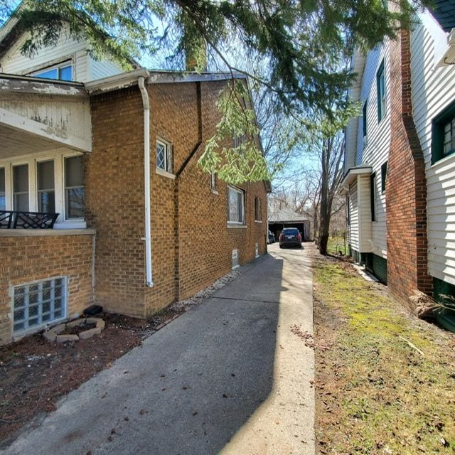 11060 Wilshire Dr, Detroit, MI 48213 - view of home's exterior featuring brick siding and a garage