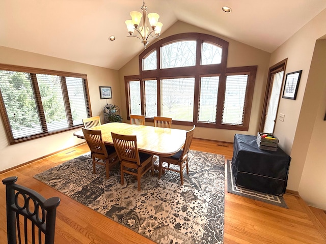 5280 Inverrary Ln, Commerce Twp, MI 48382 - dining space with lofted ceiling, a chandelier, light wood finished floors, and recessed lighting