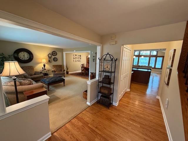 5280 Inverrary Ln, Commerce Twp, MI 48382 - living area featuring wood finished floors and baseboards