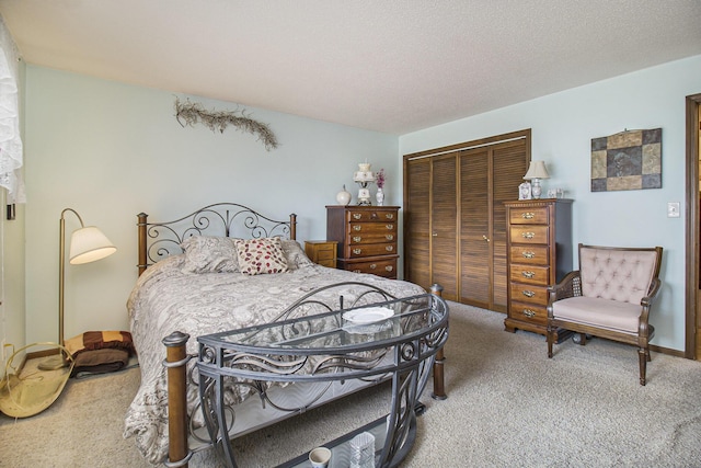 bedroom with light carpet, a closet, and a textured ceiling