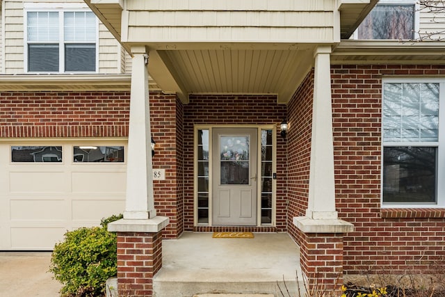 3885 Silver Charm Ln, Howell, MI 48843 - entrance to property featuring brick siding and a garage