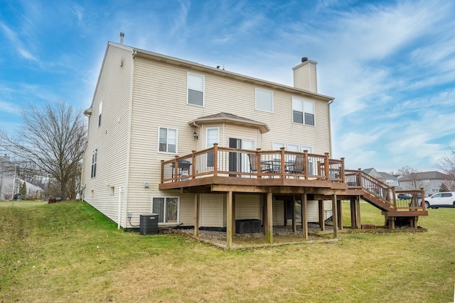 3885 Silver Charm Ln, Howell, MI 48843 - rear view of house featuring a chimney, a wooden deck, a yard, and cooling unit