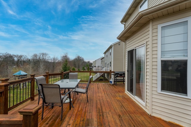 3885 Silver Charm Ln, Howell, MI 48843 - wooden terrace featuring outdoor dining area
