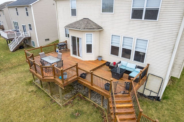 3885 Silver Charm Ln, Howell, MI 48843 - back of house featuring outdoor lounge area, outdoor dining space, a wooden deck, a lawn, and stairway