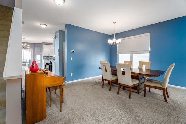 3885 Silver Charm Ln, Howell, MI 48843 - dining room featuring a chandelier, carpet, and healthy amount of natural light