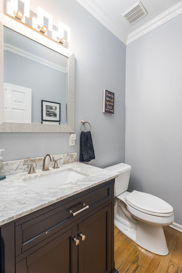 3885 Silver Charm Ln, Howell, MI 48843 - half bathroom featuring crown molding, wood finished floors, toilet, and vanity