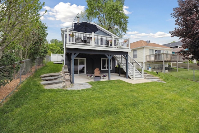 11449 Sunset Blvd, Pinckney, MI 48169 - rear view of house with a deck, a patio area, and stairs
