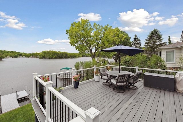 11449 Sunset Blvd, Pinckney, MI 48169 - wooden terrace featuring a water view and outdoor dining space