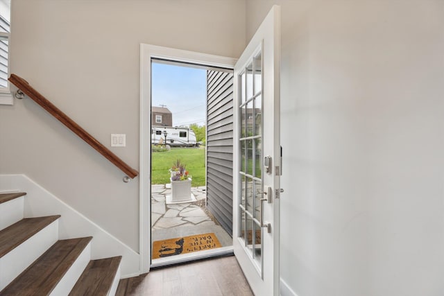 11449 Sunset Blvd, Pinckney, MI 48169 - entryway featuring wood finished floors, stairway, and french doors