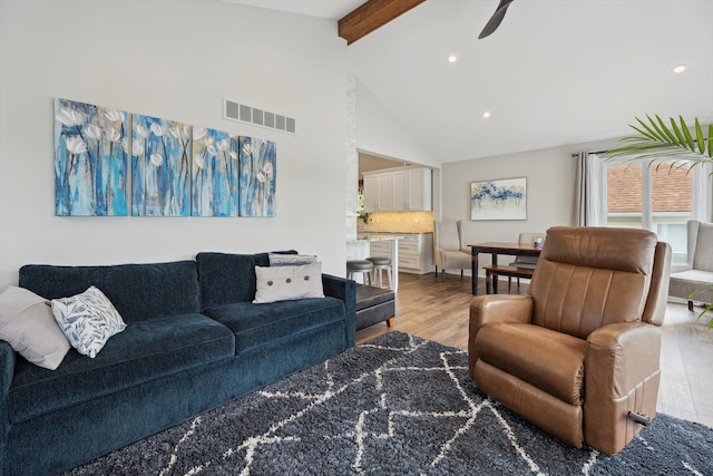11449 Sunset Blvd, Pinckney, MI 48169 - living area featuring beamed ceiling, high vaulted ceiling, wood finished floors, recessed lighting, and ceiling fan