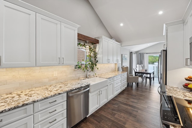 11449 Sunset Blvd, Pinckney, MI 48169 - kitchen featuring stainless steel dishwasher, vaulted ceiling, a sink, white cabinets, and decorative backsplash