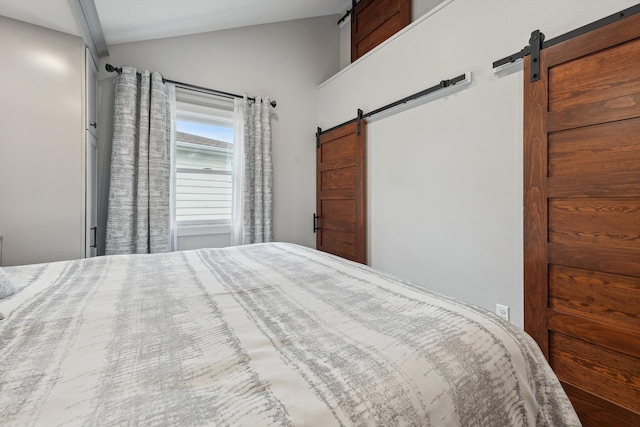 11449 Sunset Blvd, Pinckney, MI 48169 - bedroom with a barn door and lofted ceiling