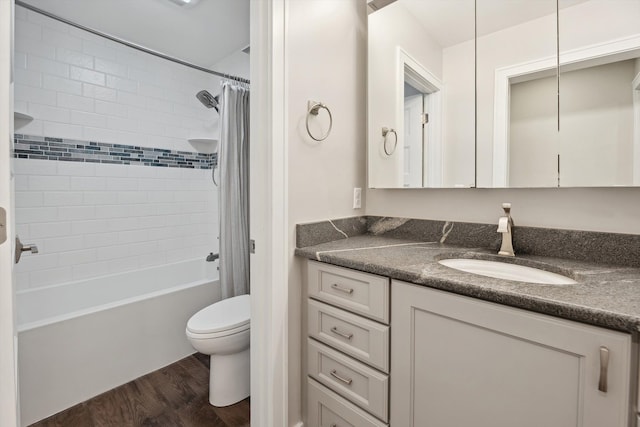 11449 Sunset Blvd, Pinckney, MI 48169 - full bath with vanity, wood finished floors, toilet, and shower / bathtub combination with curtain