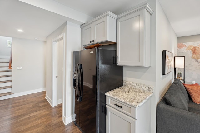 11449 Sunset Blvd, Pinckney, MI 48169 - kitchen with black fridge with ice dispenser, dark wood-style floors, baseboards, light stone counters, and recessed lighting