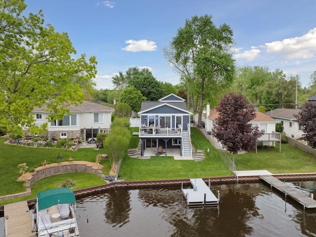 11449 Sunset Blvd, Pinckney, MI 48169 - back of property featuring boat lift, stairway, a patio, a deck with water view, and a yard