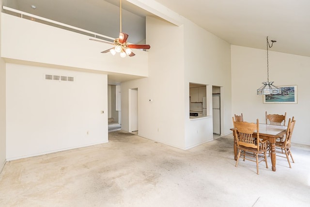 dining area featuring carpet flooring, baseboards, visible vents, ceiling fan, and high vaulted ceiling