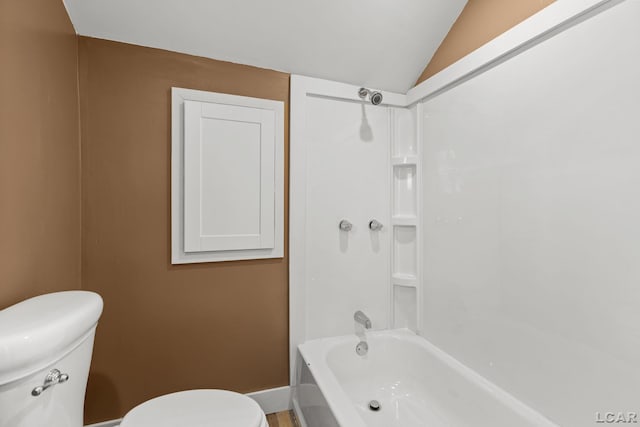 full bathroom with toilet, bathing tub / shower combination, baseboards, and vaulted ceiling