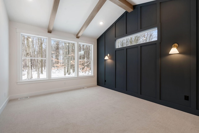 empty room featuring carpet floors and baseboards