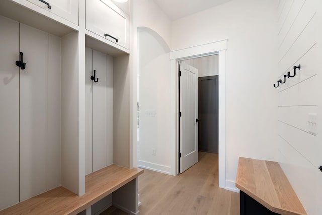 mudroom with light wood-type flooring and baseboards