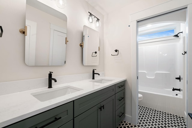 full bathroom with double vanity, toilet, and bathtub / shower combination
