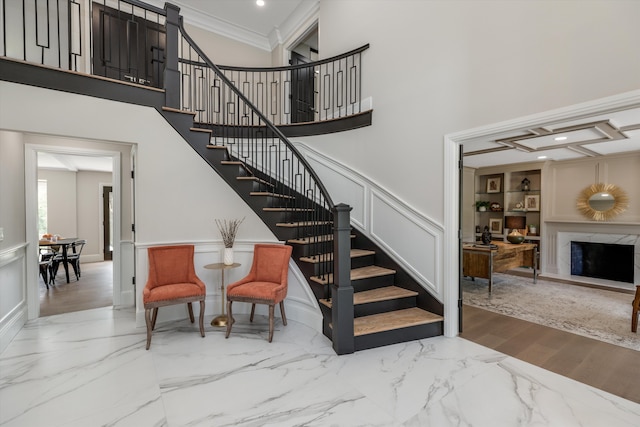245 Chestnut Cir, Bloomfield Hills, MI 48304 - staircase featuring a decorative wall, a high ceiling, crown molding, marble finish flooring, and a wainscoted wall