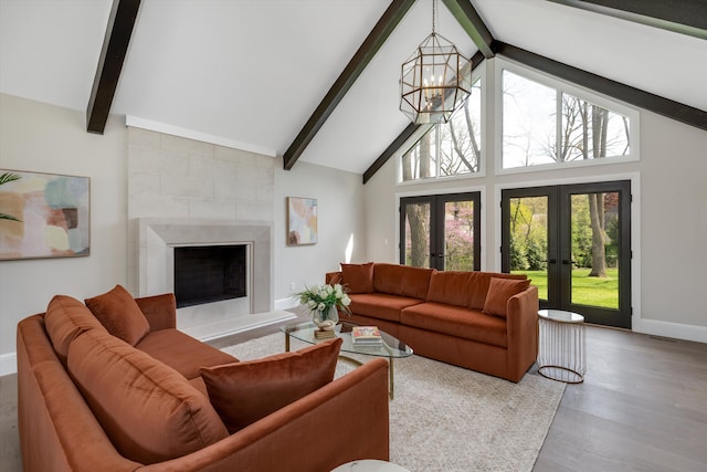 245 Chestnut Cir, Bloomfield Hills, MI 48304 - living room with a chandelier, beamed ceiling, high vaulted ceiling, baseboards, and wood finished floors