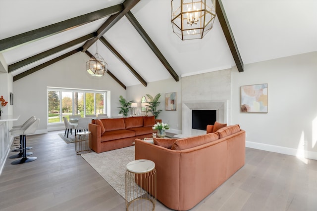 245 Chestnut Cir, Bloomfield Hills, MI 48304 - living room with baseboards, beam ceiling, a chandelier, light wood finished floors, and a large fireplace