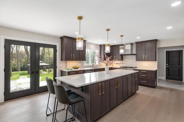 245 Chestnut Cir, Bloomfield Hills, MI 48304 - kitchen with wall chimney exhaust hood, a sink, backsplash, dark brown cabinets, and recessed lighting