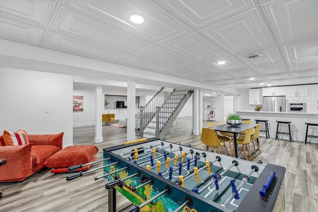 245 Chestnut Cir, Bloomfield Hills, MI 48304 - game room with light wood-style flooring, an ornate ceiling, and recessed lighting