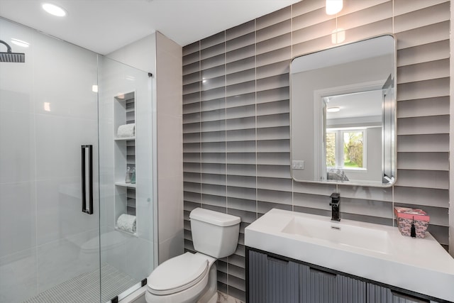 245 Chestnut Cir, Bloomfield Hills, MI 48304 - bathroom with tile walls, toilet, a stall shower, and vanity