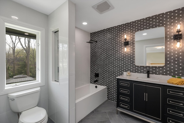 245 Chestnut Cir, Bloomfield Hills, MI 48304 - bathroom featuring tile patterned floors, toilet, vanity, tile walls, and  shower combination
