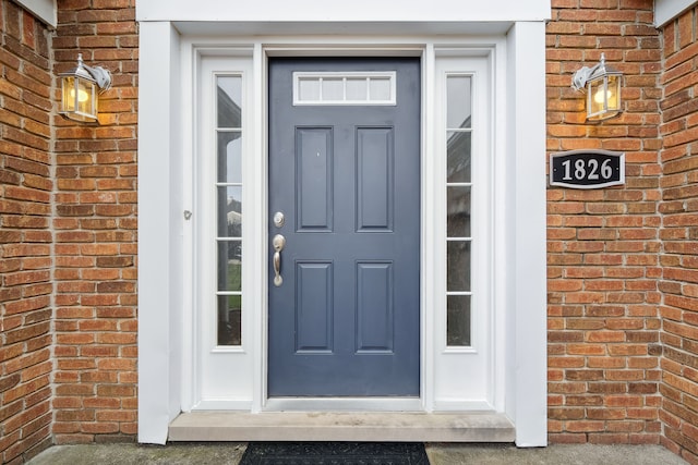 1826 Poppleton Dr, West Bloomfield, MI 48324 - doorway to property featuring brick siding