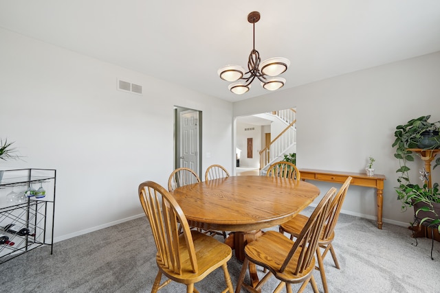 1826 Poppleton Dr, West Bloomfield, MI 48324 - dining space with light colored carpet, a notable chandelier, visible vents, and stairs