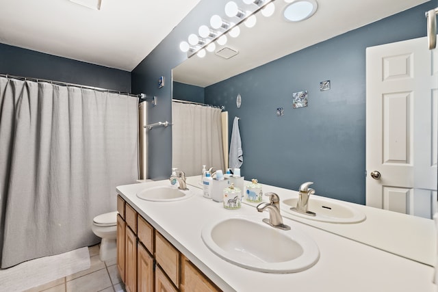1826 Poppleton Dr, West Bloomfield, MI 48324 - bathroom featuring tile patterned floors, double vanity, a sink, and toilet