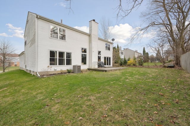 1826 Poppleton Dr, West Bloomfield, MI 48324 - rear view of property with cooling unit, a chimney, and a lawn