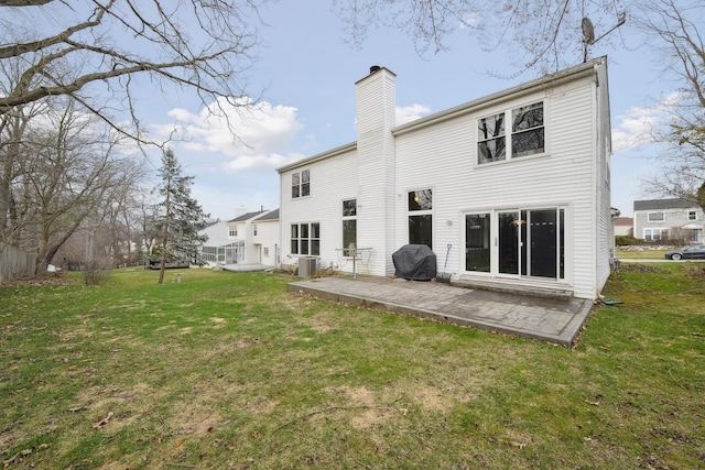 1826 Poppleton Dr, West Bloomfield, MI 48324 - back of house featuring a yard, a patio, a chimney, and central AC unit