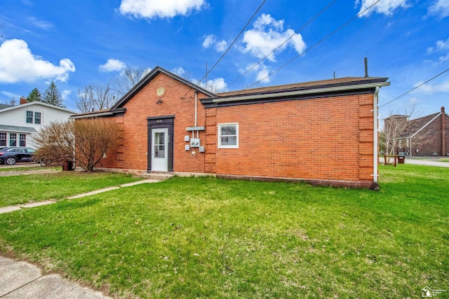 12800 Matthews St, Carleton, MI 48117 - view of front of property with brick siding and a front lawn