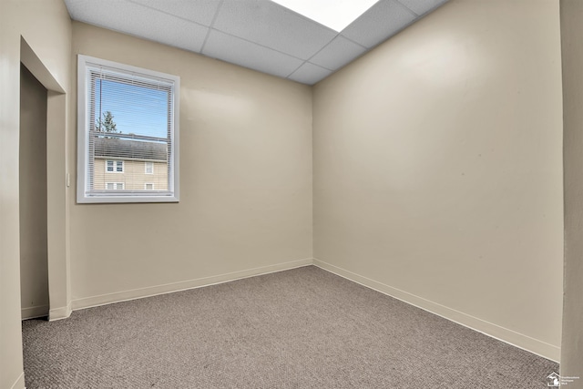 12800 Matthews St, Carleton, MI 48117 - carpeted empty room with baseboards and a drop ceiling