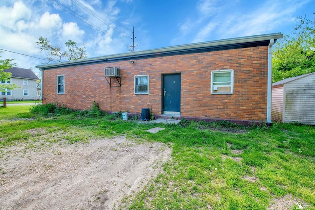 12800 Matthews St, Carleton, MI 48117 - rear view of house with brick siding and central air condition unit