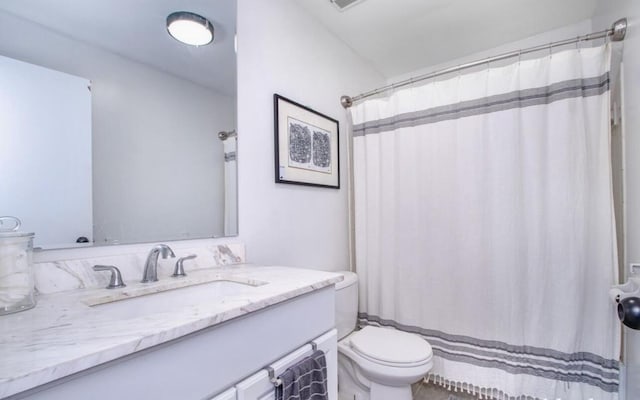 bathroom with vanity, visible vents, a shower with curtain, and toilet