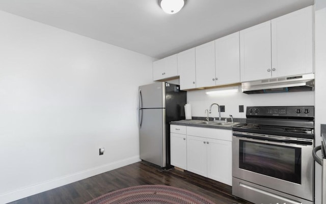 kitchen with under cabinet range hood, white cabinetry, a sink, and appliances with stainless steel finishes