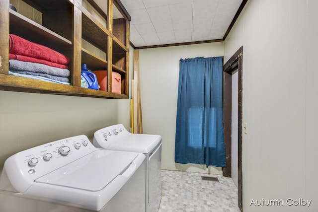 laundry room featuring laundry area, ornamental molding, and independent washer and dryer