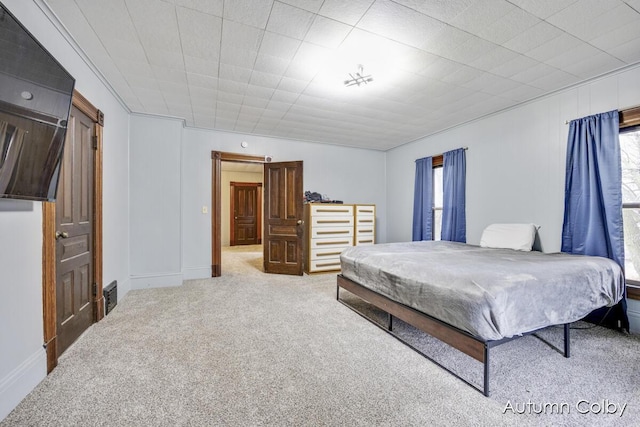 carpeted bedroom featuring visible vents
