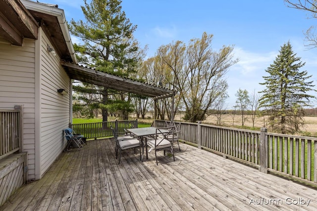 deck with outdoor dining area
