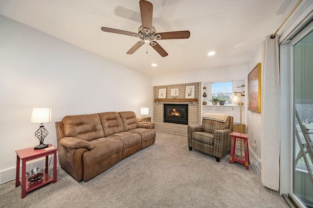 living area with ceiling fan, a fireplace, recessed lighting, and carpet floors