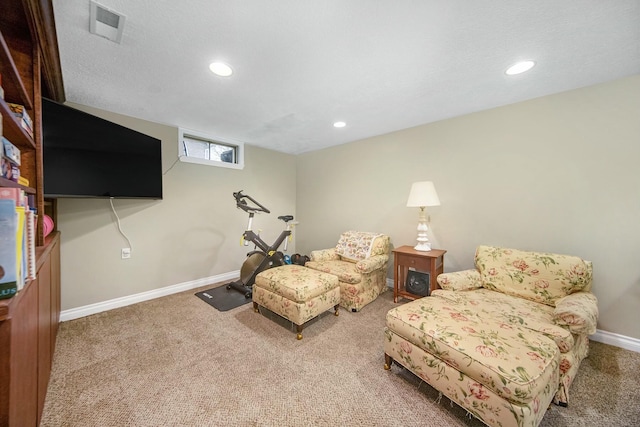 sitting room featuring visible vents, baseboards, a textured ceiling, carpet floors, and recessed lighting