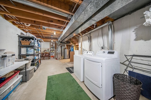 unfinished below grade area with gas water heater and washer and clothes dryer